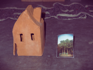 detail from 'Grim Reaper' installation, Ceramic sculpture 'House' with photograph 'Forest & fence' by Esther Francis, for  group exhibition Tumult in Gent #2, 2014